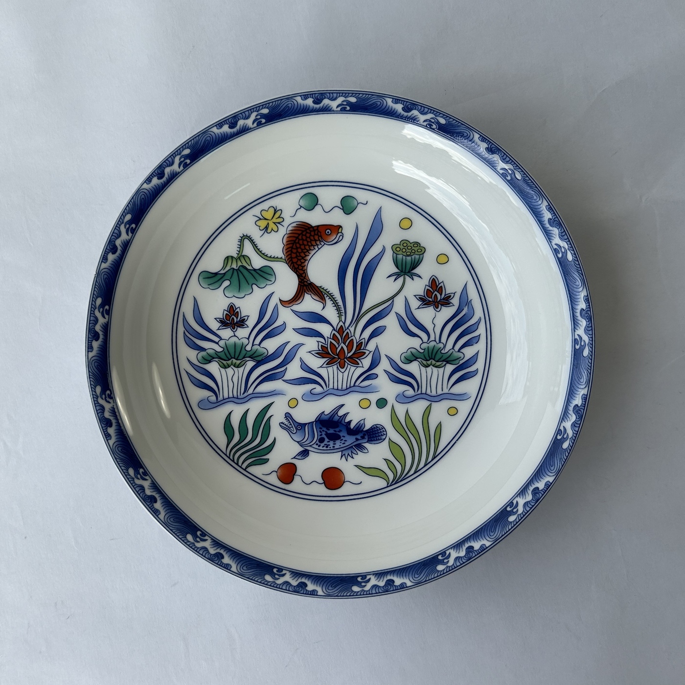 Ceramic plate with enamel painting